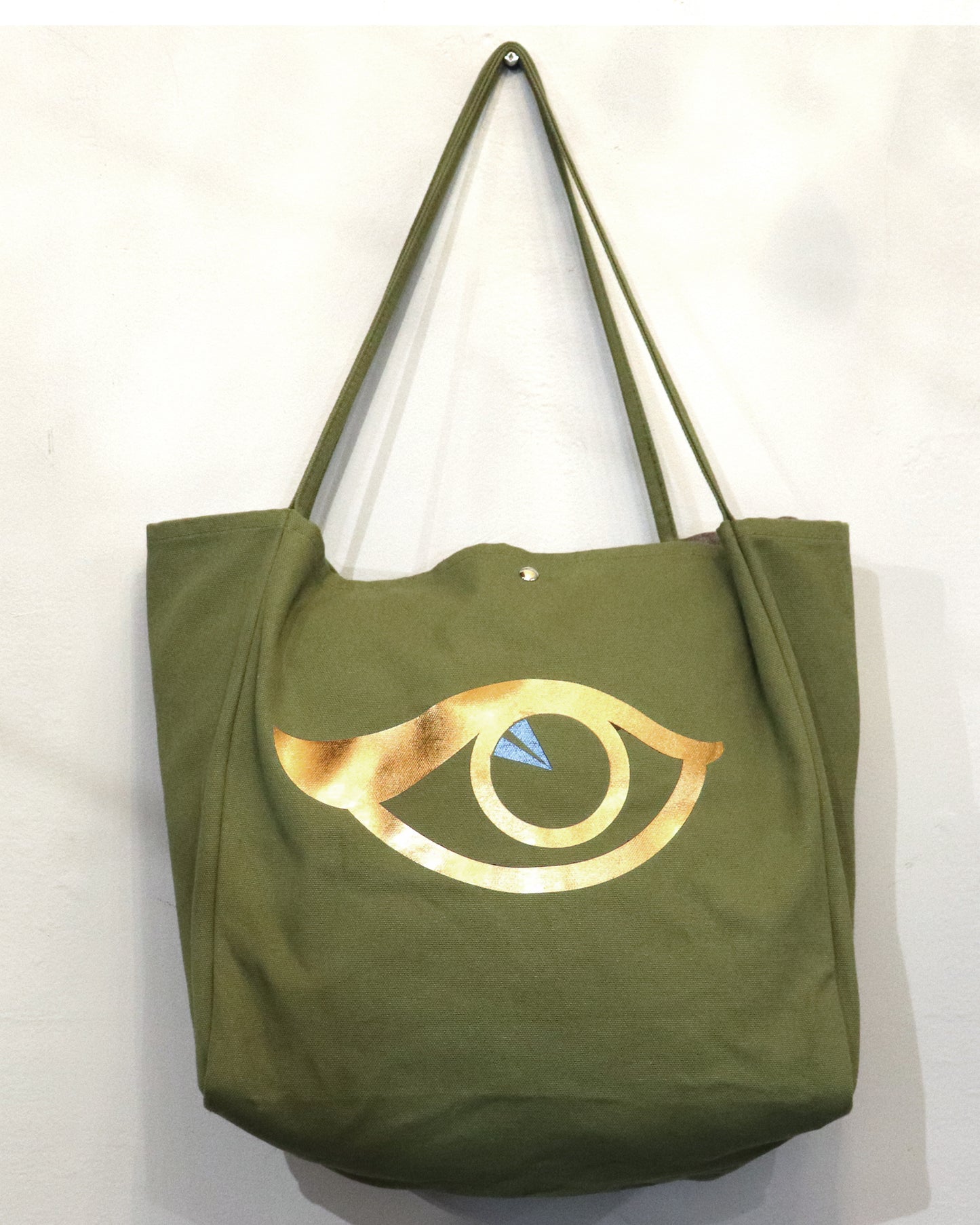 Bolso de mano con forma de ojo